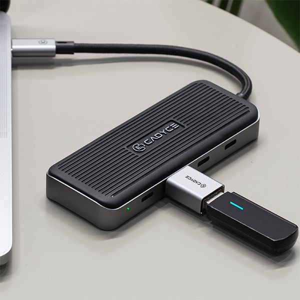 Cadyce CA-CC4H10G USB‑C hub showcasing its compact four‑port layout