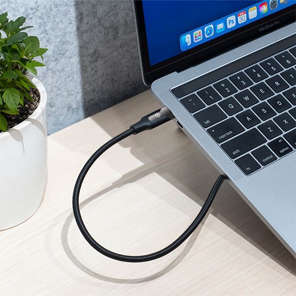 USB-C 3.1 sync and charge cable with black jacket connected to laptop port.