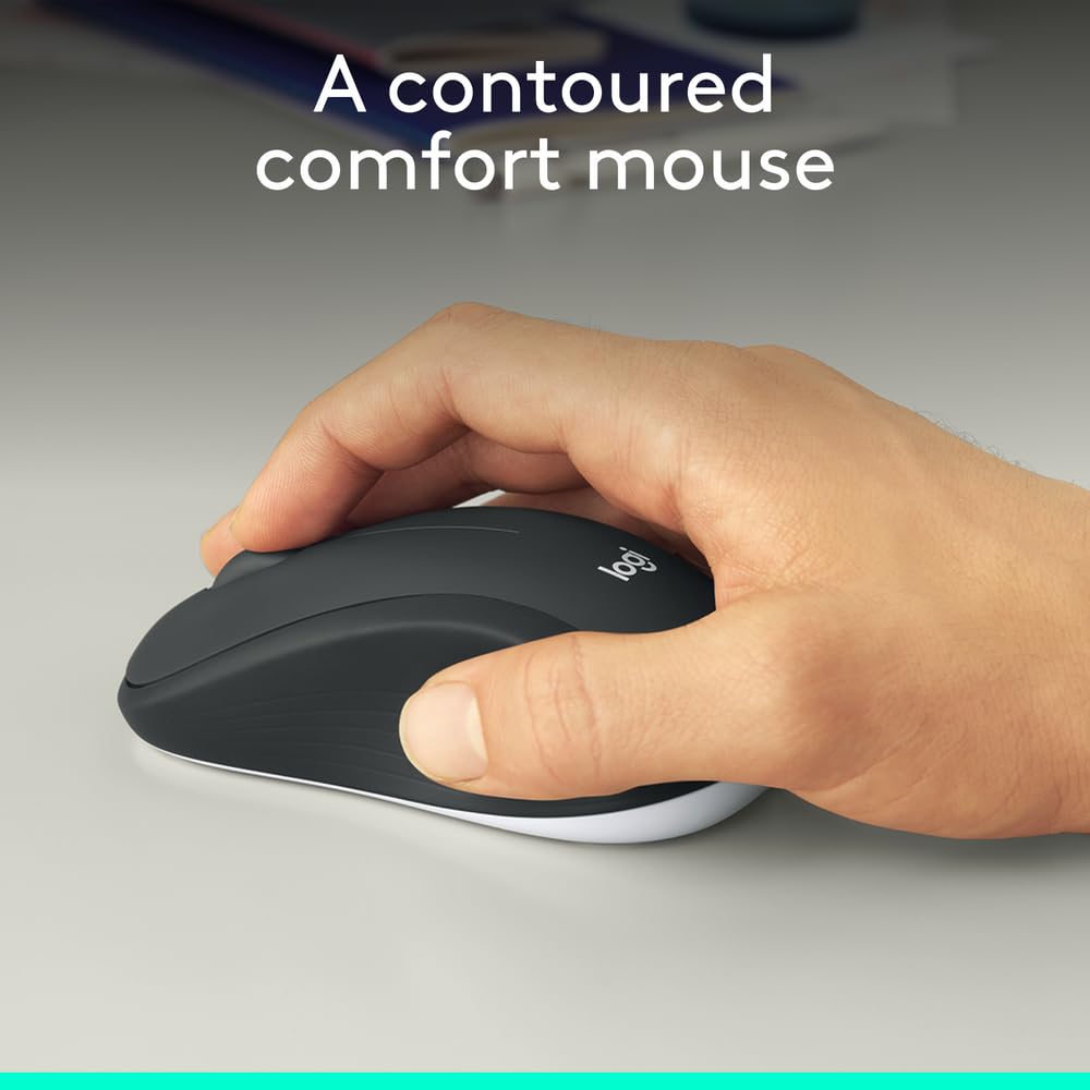 Hand holding a Logitech contoured comfort mouse on a neutral background