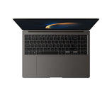 A dark gray laptop shown open from a top-down perspective on a solid white background, displaying a black keyboard and a screen with a dark wallpaper.