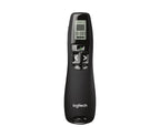Logitech presentation remote control in matte black with a small LCD display and directional buttons, shown on a plain white background.