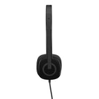 Black over-ear wired headphones shown from the side profile on a solid white background.