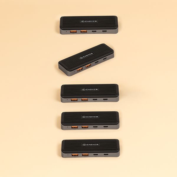 Cadyce CA-C2U2H close‑up of two USB‑A ports and two USB‑C ports with label markings