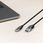 USB cable with Type-C and USB-A connectors on a light surface
