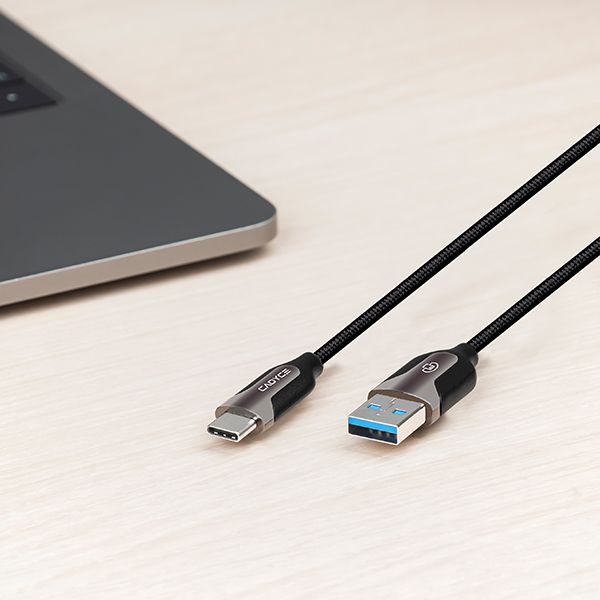 USB cable with Type-C and USB-A connectors on a light surface