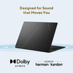 A black laptop shown open at an angle on a light blue background, with the text 'Designed for Sound that Moves You' above it and Dolby Atmos and harman/kardon branding below.