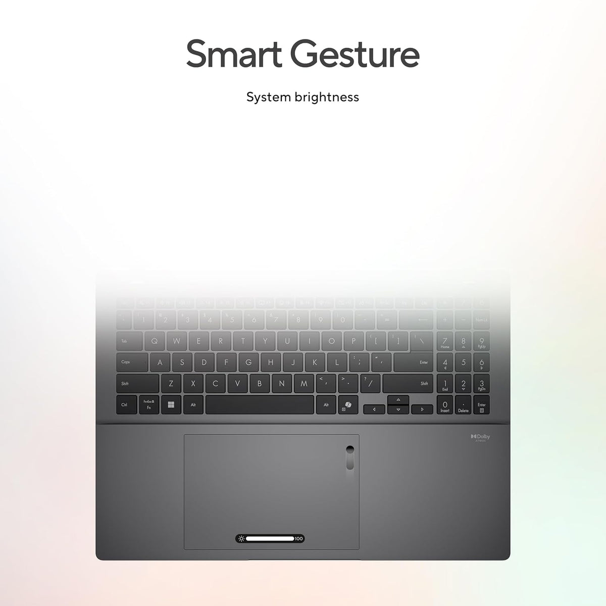 A laptop or tablet keyboard and trackpad area shown against a soft white-to-light-gray gradient background, with the text 'Smart Gesture' and 'System brightness' above it.