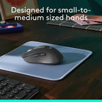 Mouse on a blue mouse pad with text 'Designed for small-to-medium sized hands' on a desk.