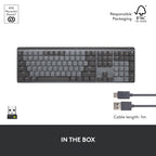 Black keyboard with USB cable on a white background, featuring recycled plastic and FSC logos.