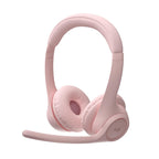 A light pink Logitech over-ear headset with an adjustable microphone, shown on a solid white background.
