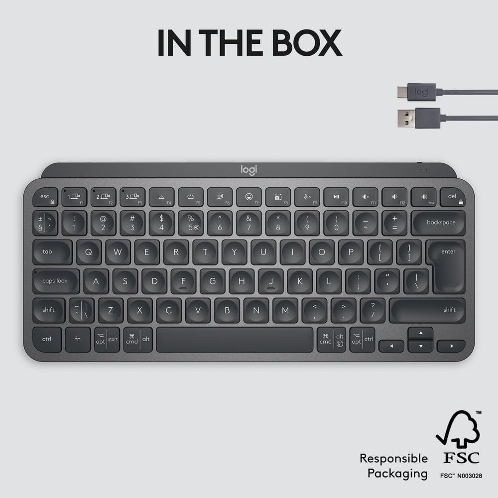Logitech keyboard with USB cable on a light gray background