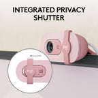 Pink webcam with integrated privacy shutter on a light background