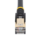 StarTech C6ASPAT10BK 10ft Cat6a Shielded Ethernet Cable black cable coiled on white background