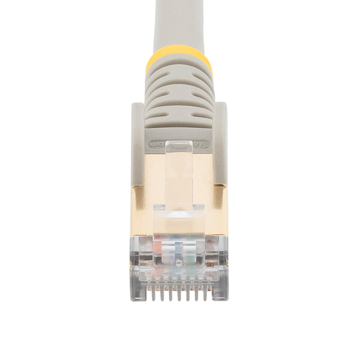 StarTech C6ASPAT10GR 10ft Cat6a Shielded Ethernet Cable grey cable coiled on a desk