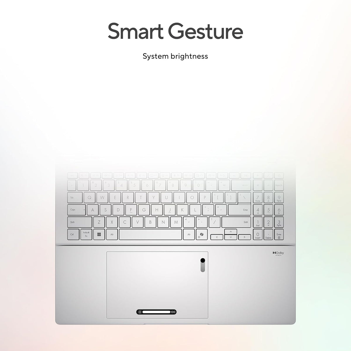 A silver laptop shown from the front with a blurred keyboard and trackpad, under the text 'Smart Gesture' and 'System brightness' on a soft white-to-light-gray gradient background.
