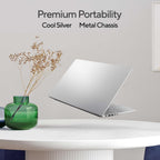 A silver laptop floating above a white table with a green glass vase and dried stems, with text reading 'Premium Portability Cool Silver Metal Chassis' on a light gray wall.