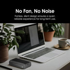 Laptop on a desk with a small device labeled 'No Fan, No Noise' and text about its design.