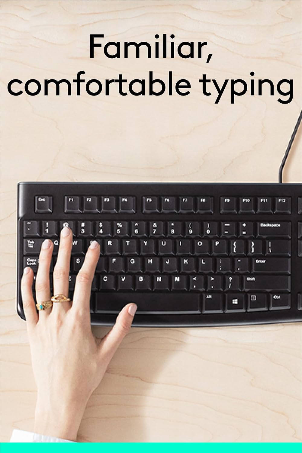 Person typing on a black keyboard with text 'Familiar, comfortable typing' above.