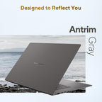 A dark gray laptop shown open at an angle over a coastal scene, with text reading 'Designed to Reflect You' and 'Antrim Gray' on a pale background.