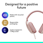 Pink headphones with sustainability features on a white background