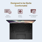 A black laptop shown open on a pale blue background with marketing text above: 'Designed to be Quite Comfortable' and feature icons for a silent keyboard, emoji hotkey, and anti-fingerprint touchpad.