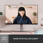 Person using a computer with a webcam on a desk, showing a video call with a woman on the screen.
