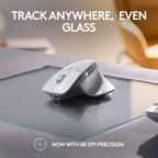 White computer mouse on a glass surface with text 'Track Anywhere, Even Glass' and 'Now with 8K DPI Precision'.