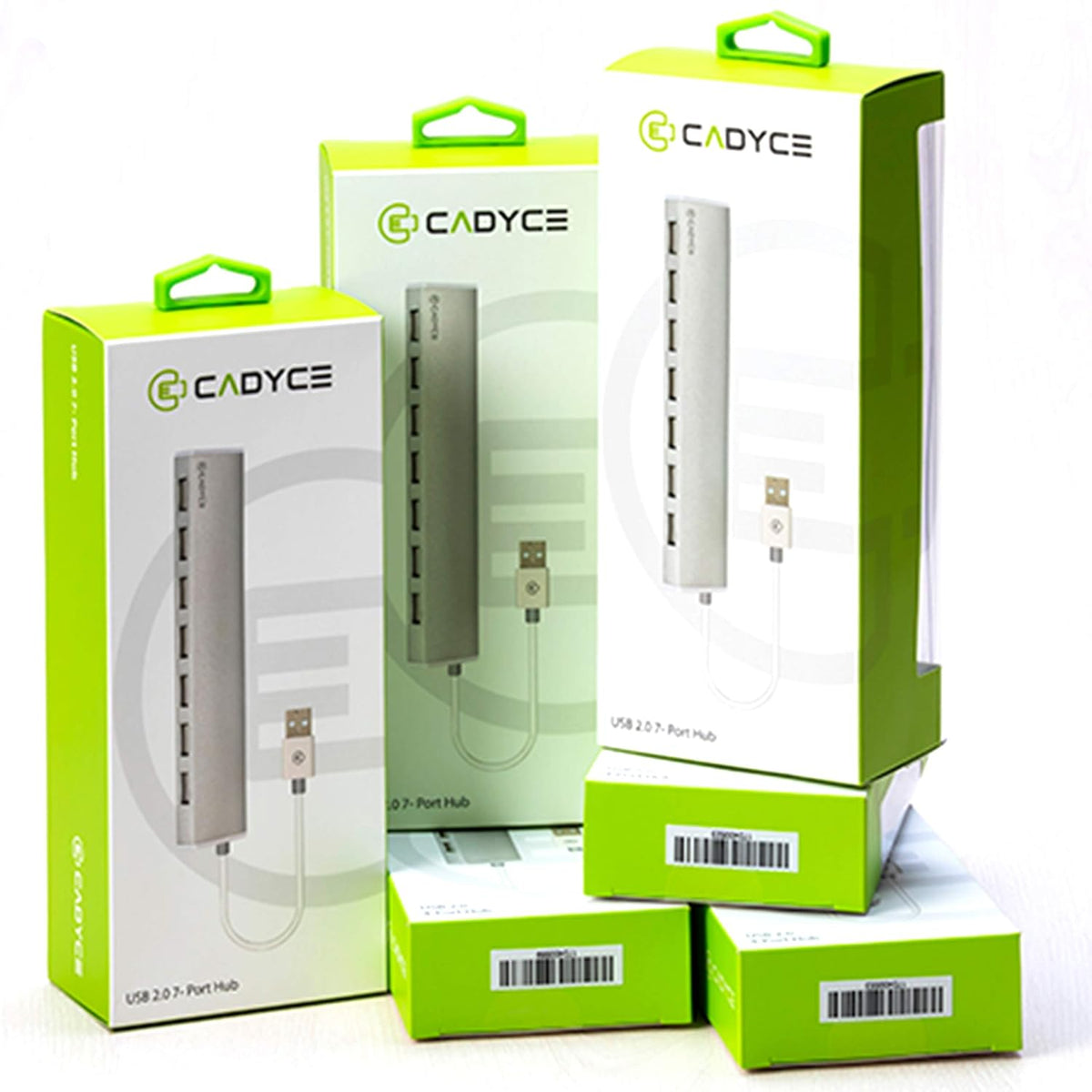Three CADYCE USB 2.0-3 Port Hub product boxes in bright green and white packaging, arranged together on a white background.