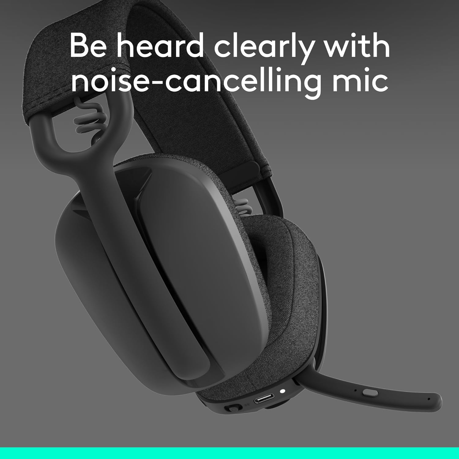 Black gaming headset with text 'Be heard clearly with noise-cancelling mic' on a gray background