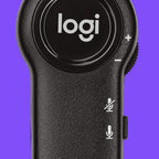 Black Logitech device with control buttons on a purple background