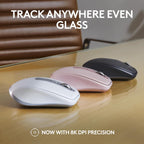 Three wireless computer mice on a reflective surface with text about tracking precision.