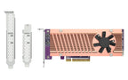 A PCI-e graphics card with a copper-colored heatsink, black cooling fan, purple circuit board, and gold PCIe connector, shown alongside two silver metal bracket adapters on a plain white background.