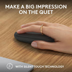 Hand using a black computer mouse on a wooden desk with text about silent touch technology.
