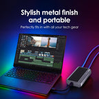 Laptop with external graphics card and colorful lighting on a dark background
