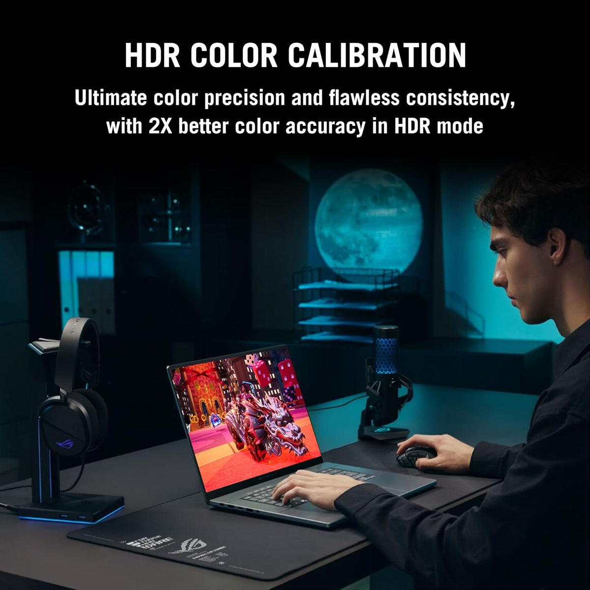 A man sits at a desk using a laptop in a dimly lit room with blue ambient lighting. Large text at the top reads 'HDR COLOR CALIBRATION' with a subtitle about color precision and consistency.