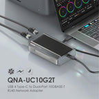 A QNAA-UC10G2T USB 4 Type-C to Dual-Port 10GBASE-T RJ45 network adapter shown on a reflective gray surface next to a laptop and cables, with product text below.