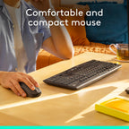 Person using a computer mouse and keyboard on a desk with text 'Comfortable and compact mouse'.