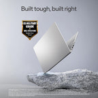 A silver ASUS laptop floating above a gray rock against a light gray background, with the headline 'Built tough, built right' and a 'US Military Grade MIL-STD 810H' badge. Small disclaimer text appears at the bottom.