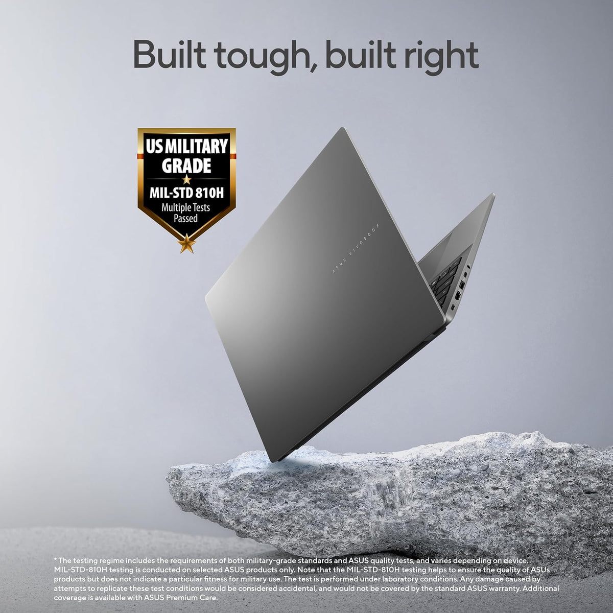 Laptop on a rock with 'Built tough, built right' text and military grade certification badge.