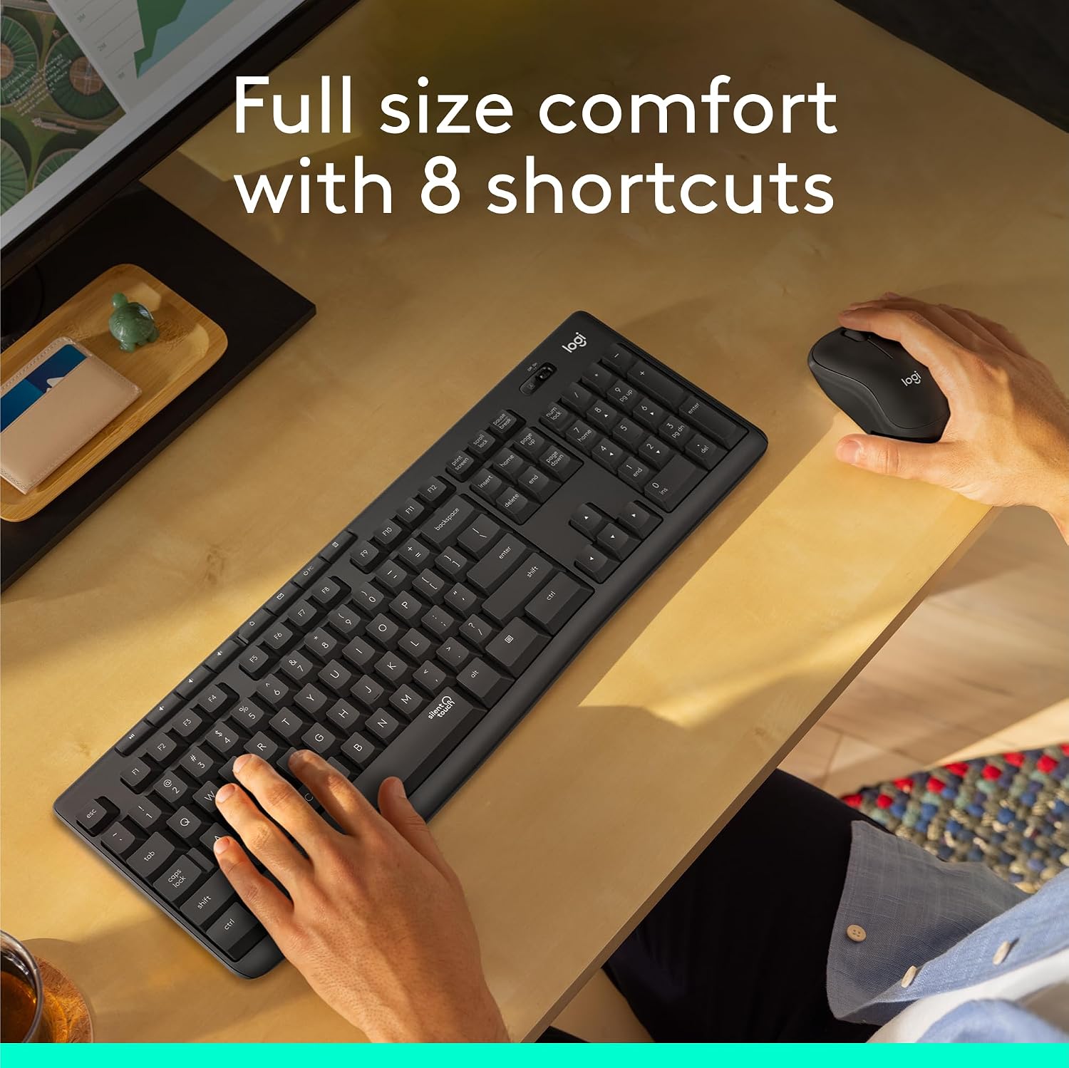 Person using a black keyboard and mouse on a desk with text 'Full size comfort with 8 shortcuts'.