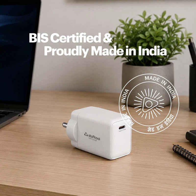 A white euftool USB-C power adapter sits on a light wood desk, with a laptop, potted plant, and notebook in the background. White text overlays read 'BIS Certified & Proudly Made in India' along with a circular 'Made in India' badge.