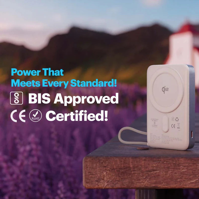 Power bank on a wooden surface with lavender and mountains in the background, featuring certification text.