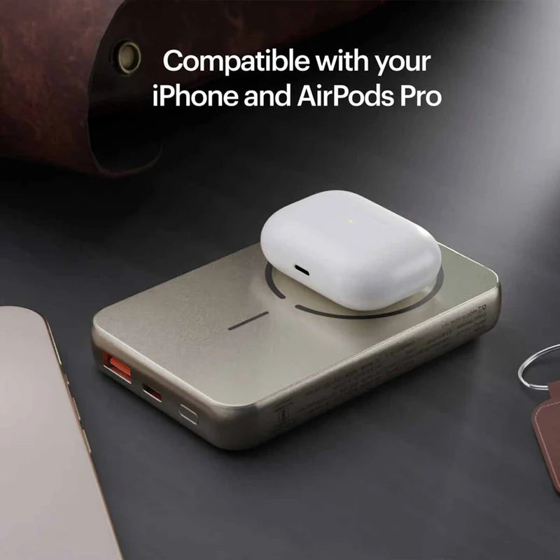 Wireless charging pad with AirPods Pro on a dark surface, text indicating compatibility with iPhone and AirPods Pro.