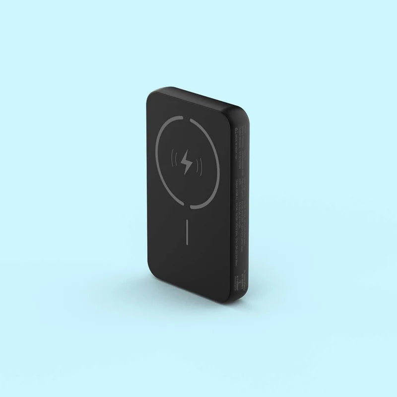 Black wireless charging pad on a light blue background