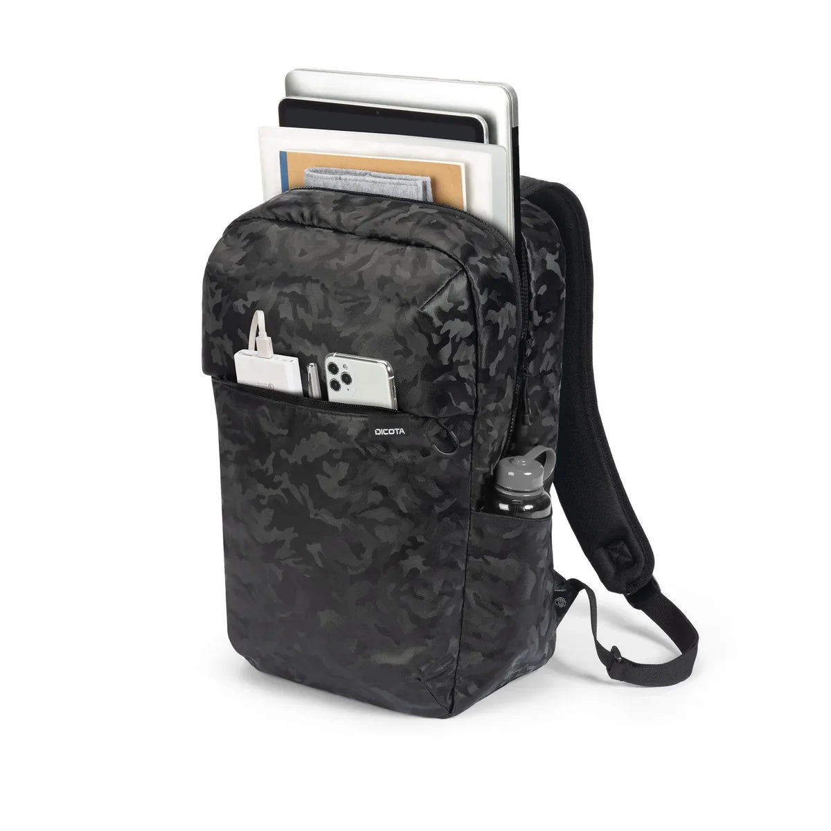 A black and dark gray camouflage backpack shown on a white background, filled with a laptop, notebooks, a smartphone, a pen, and a water bottle.