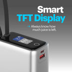 A silver portable power bank with a black top panel showing a blue TFT display and text that reads 'Smart TFT Display' and 'Always know how much juice is left.' on a gray gradient background.