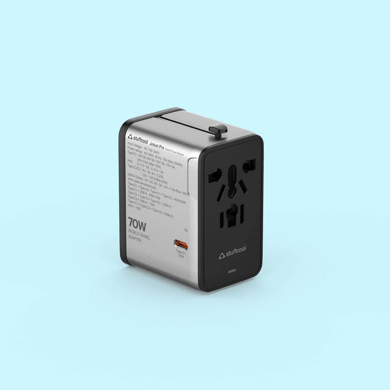 A 70W travel adapter by Airtool, featuring a dual-tone silver and black design, shown on a solid light blue background.