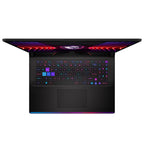 A black gaming laptop shown open from a front-facing perspective, featuring vibrant multicolor RGB backlighting on the keyboard and screen bezel, set against a plain white background.