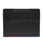 The rear view of a black Lenovo Legion Raider gaming laptop, featuring the embossed 'RAIDER' logo on the backplate, a small red accent logo, and a vibrant RGB LED light strip along the bottom edge.