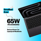 A promotional graphic showing a black laptop charger and a partial black laptop on a light blue gradient background, with text reading 'Smallest Ever 65W PD CHARGING Serious Power for Laptops & MacBooks'.